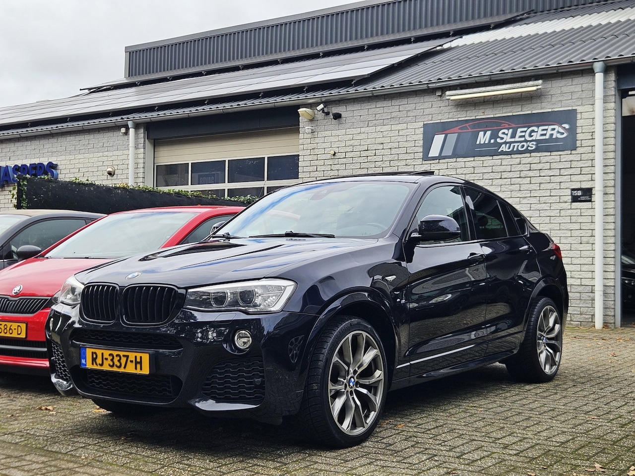 BMW X4 - XDrive35d High Executive*M pakket*Panodak*Carbon black - AutoWereld.nl