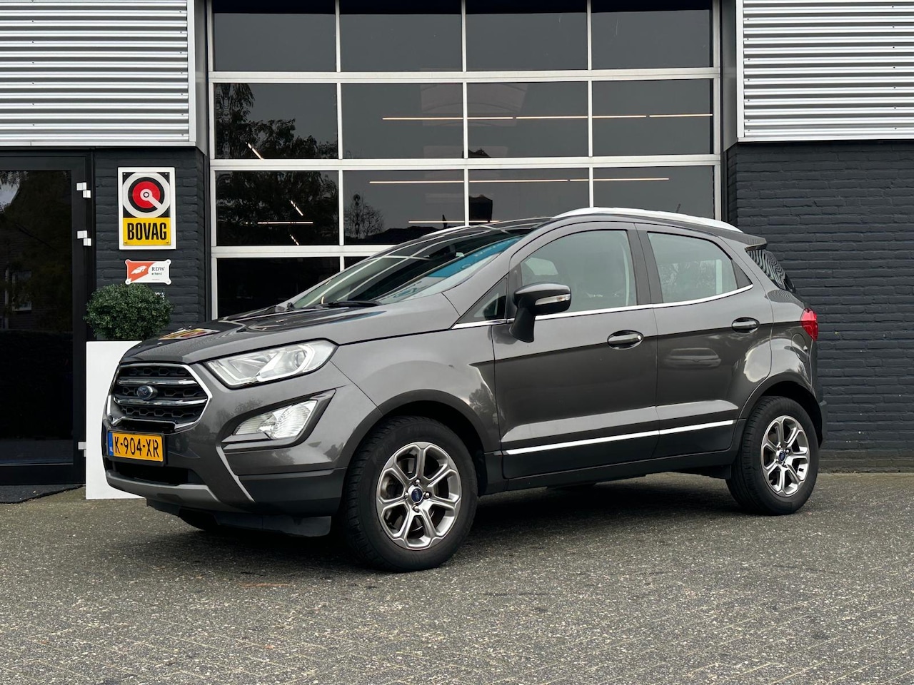 Ford EcoSport - 1.0 EcoBoost Titanium 1.0 EcoBoost Titanium, Airco, Bluetooth, CarPlay, Cruise, Navi, PDC - AutoWereld.nl