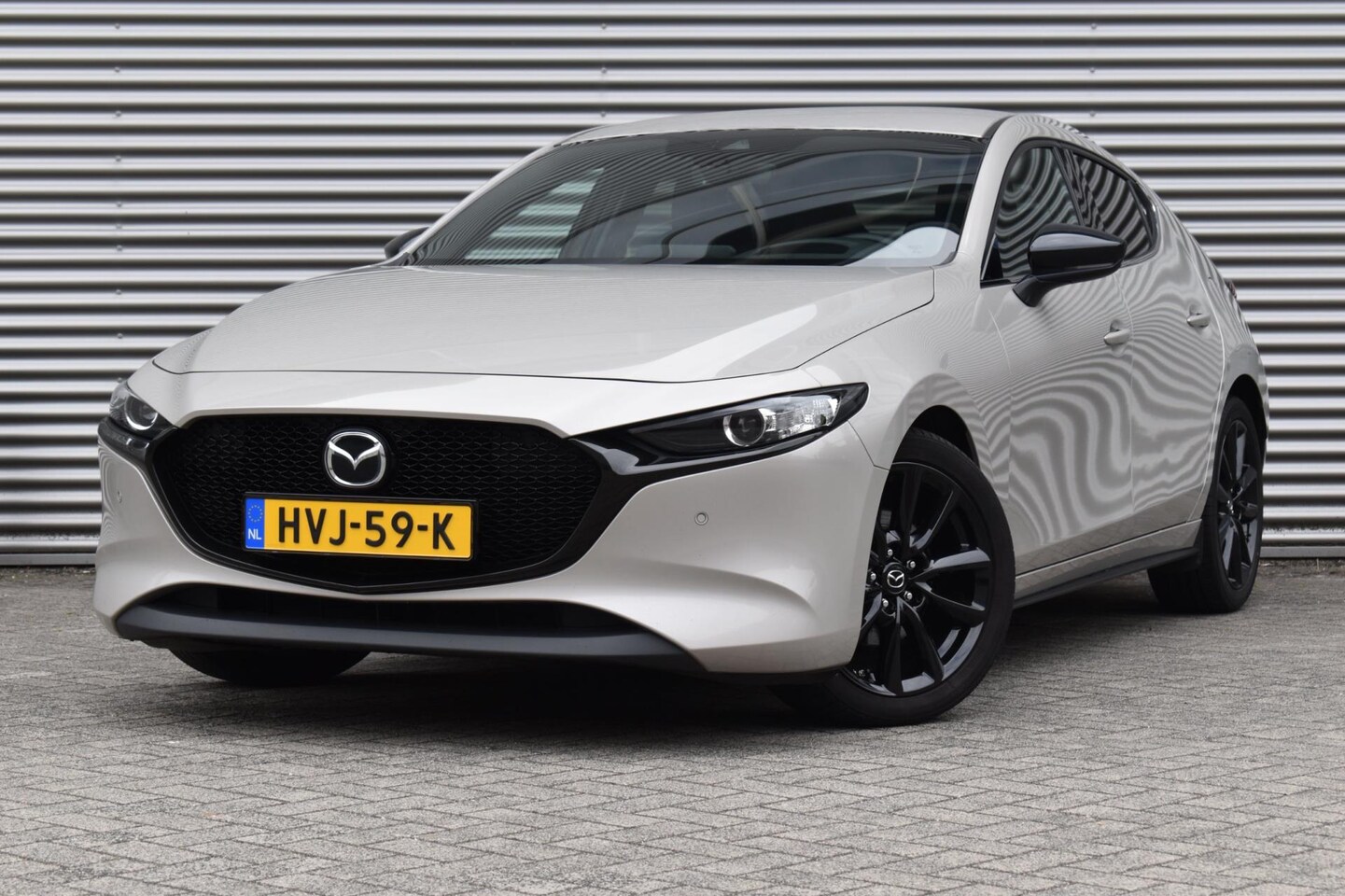 Mazda 3 - 2.0 e-SkyActiv-G M Hybrid HOMURA, Ecc, Camera, Xenon. - AutoWereld.nl