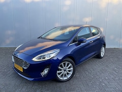 Ford Fiesta - Ecoboost Titanium 100PK | Voorruitverw. | Clima | Adap. Cruise | Camera | 4 seiz. banden |