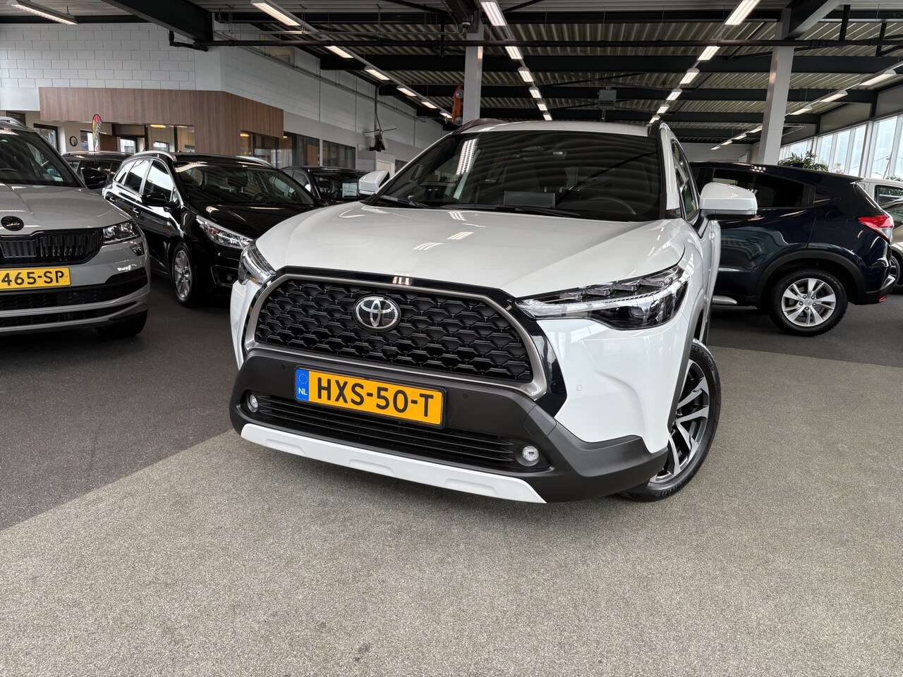 Toyota Corolla Cross - 1.8 Hybrid 140 Style Plus KEYLESS/CAMERA/NAVI/DODEHOEK/WINTERPACK - AutoWereld.nl