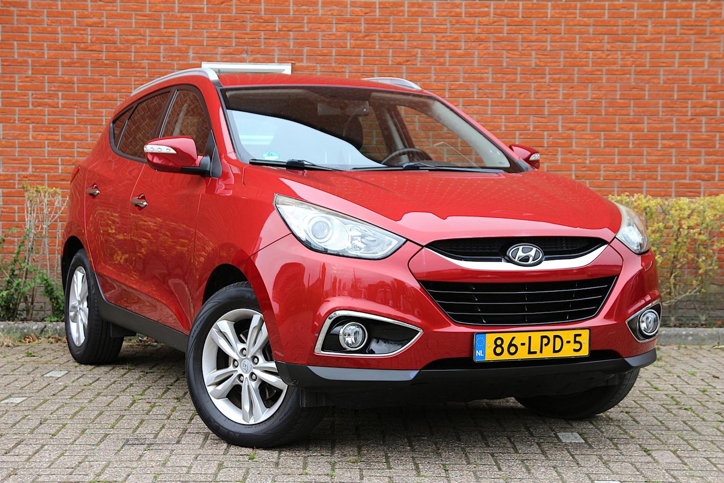 Hyundai ix35 - 2.0i Style | NL-auto | Climate control | Cruise control | Lichtmetalen velgen | Elek. rame - AutoWereld.nl