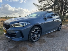 BMW 1-serie - 118i Executive Edition Automaat M-sport, Storm Bay Metallic, Panoramadak en trekhaak