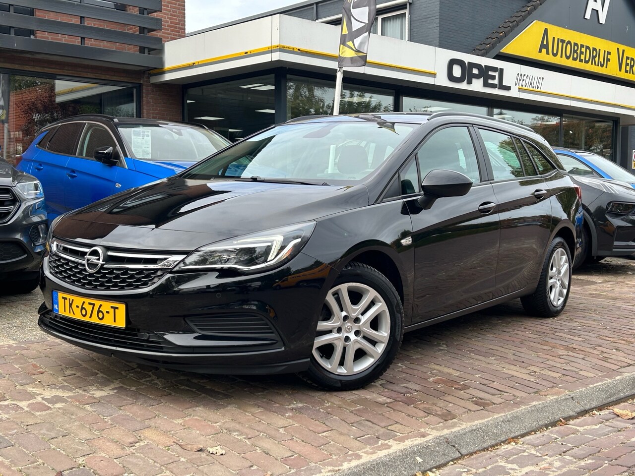 Opel Astra Sports Tourer - 1.0 Online Edition + Airco/ Cruise/ Navi/ CarPlay/ NL auto - AutoWereld.nl