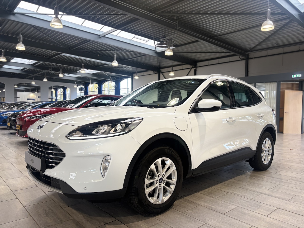 Ford Kuga - 2.5 PHEV 225 pk Titanium Winter Pack | 100% dealer onderh. | SOH 87,7% | Camera | Cruise | - AutoWereld.nl