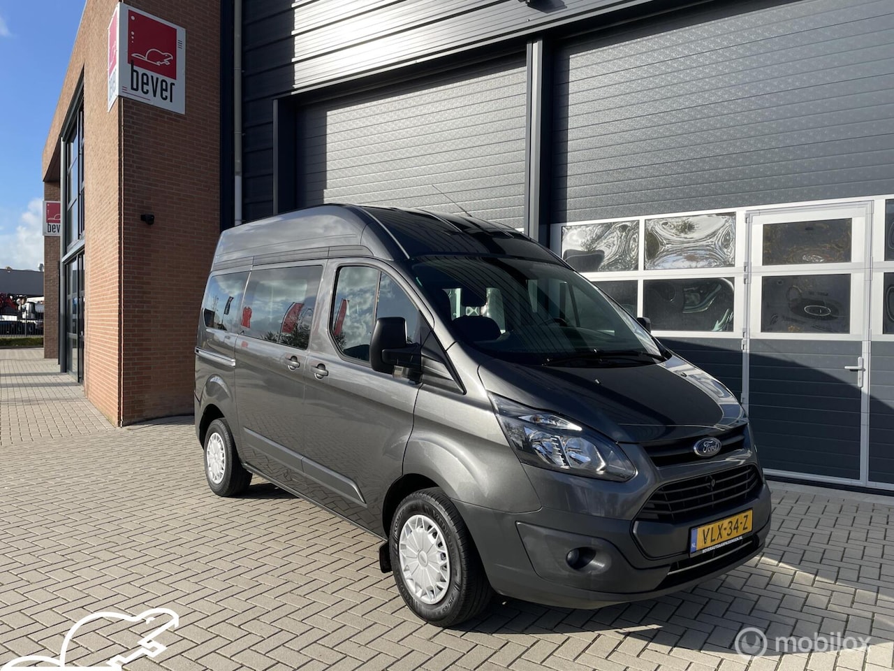 Ford Transit Custom - 270 2.0 TDCI L1H2 Ambiente rolstoelbus - AutoWereld.nl