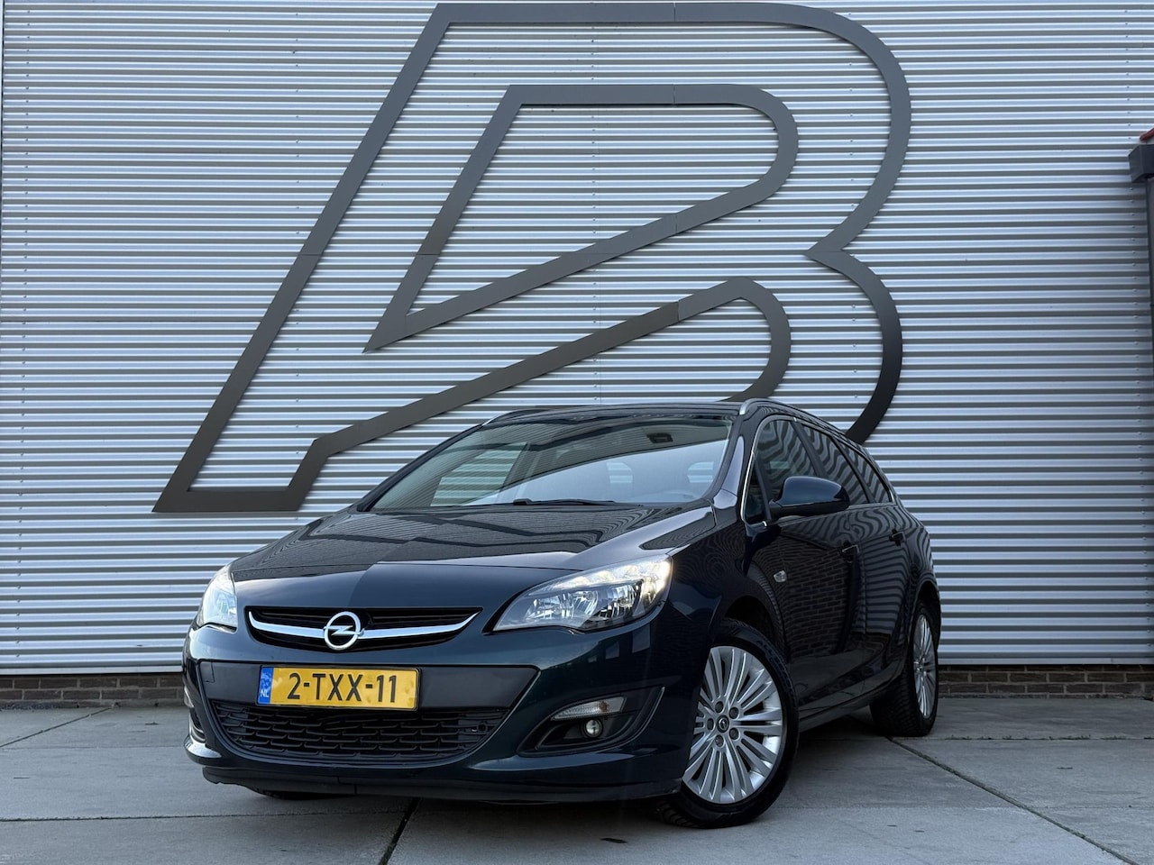 Opel Astra Sports Tourer - 1.4 Turbo Design Edition Navi|Camera|Trekhaak|PDC|Cruise|Clima|Goed onderhouden|N.A.P|APK - AutoWereld.nl