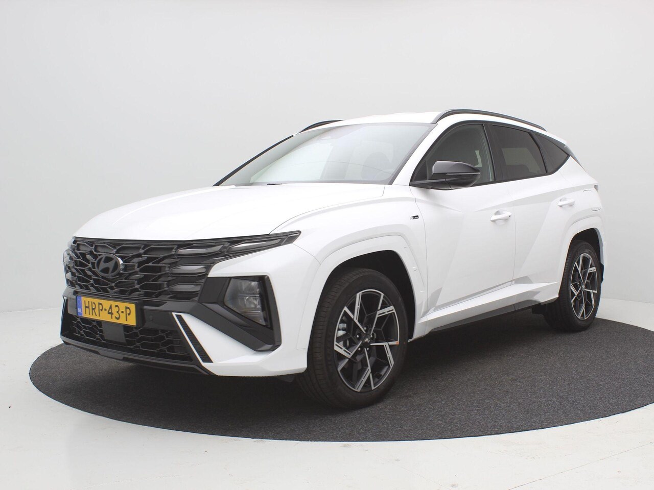 Hyundai Tucson - 1.6 T-GDI PHEV N Line Edition / Navigatie / Leer-Alcantara bekleding met rode stiksel / 19 - AutoWereld.nl
