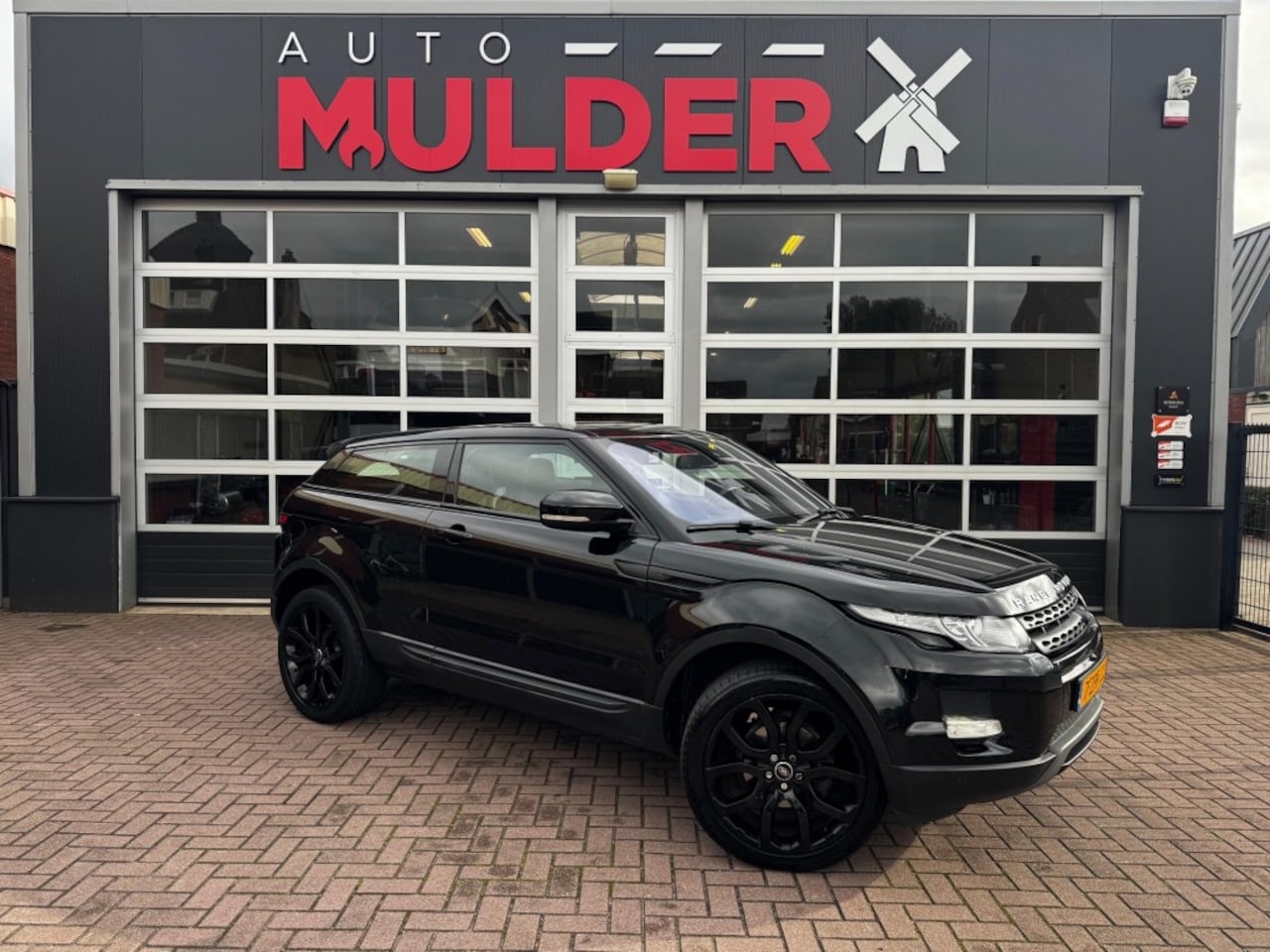 Land Rover Evoque - 2.0 SI 4WD PRESTIGE COUPE AUT. / NAVI / CRUISE / PDC / PANO / RIJKLAAR! - AutoWereld.nl