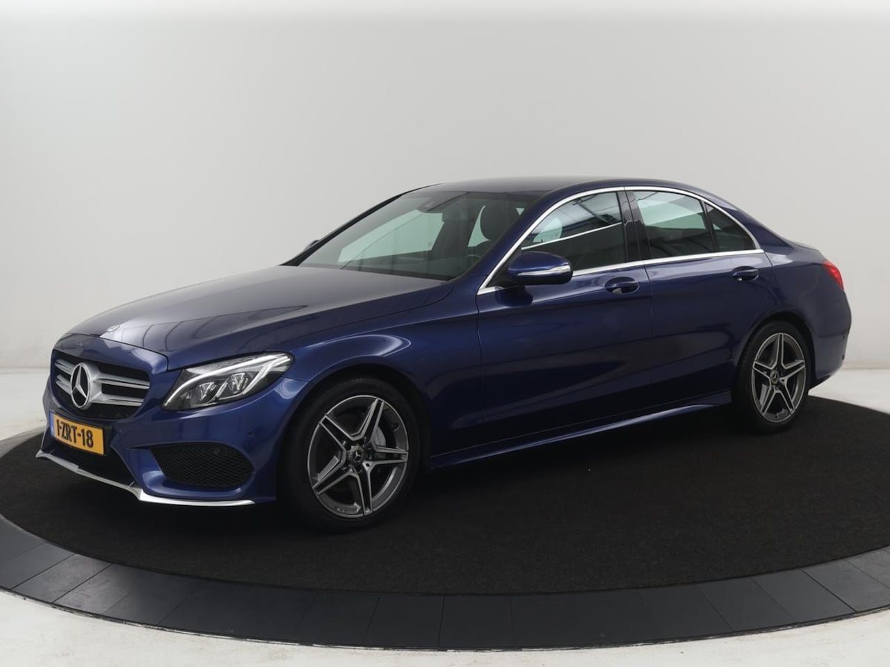 Mercedes-Benz C-klasse - 200 Ambition AMG-line | Leder | Cruise control | Elektrische stoelen | Navigatie | Bluetoo - AutoWereld.nl