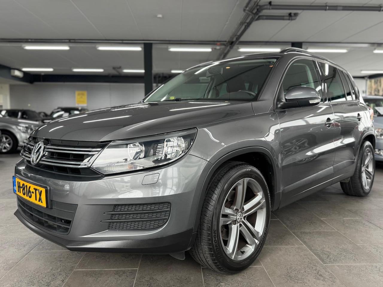 Volkswagen Tiguan - 1.4 TSI Sport&Style navi clima cruise controle lm-velgen parkeersensoren stoelverwarming t - AutoWereld.nl