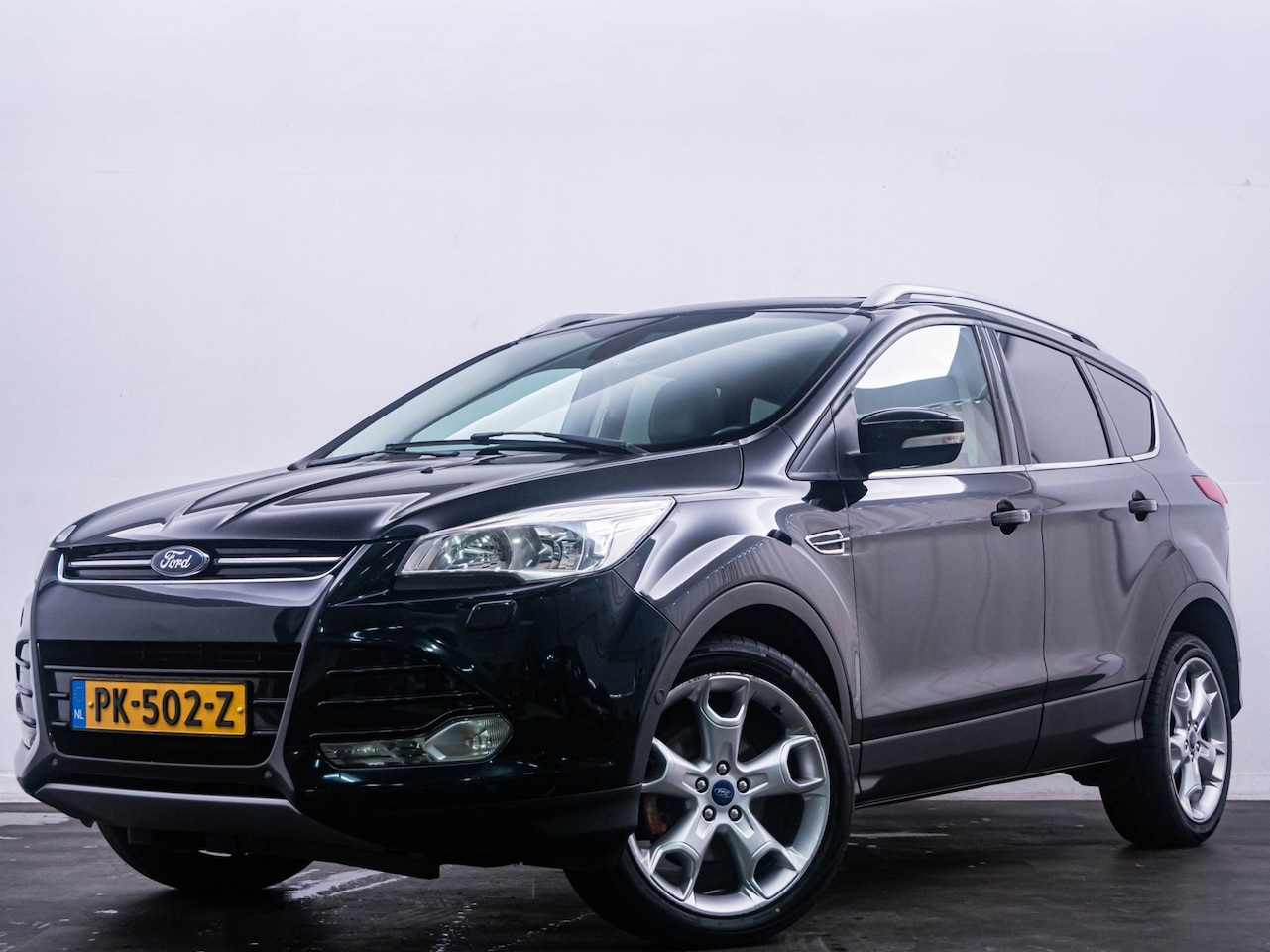 Ford Kuga - 1.6 Titanium Pano/Camera/Trekhaak/Keyless/Navi! - AutoWereld.nl