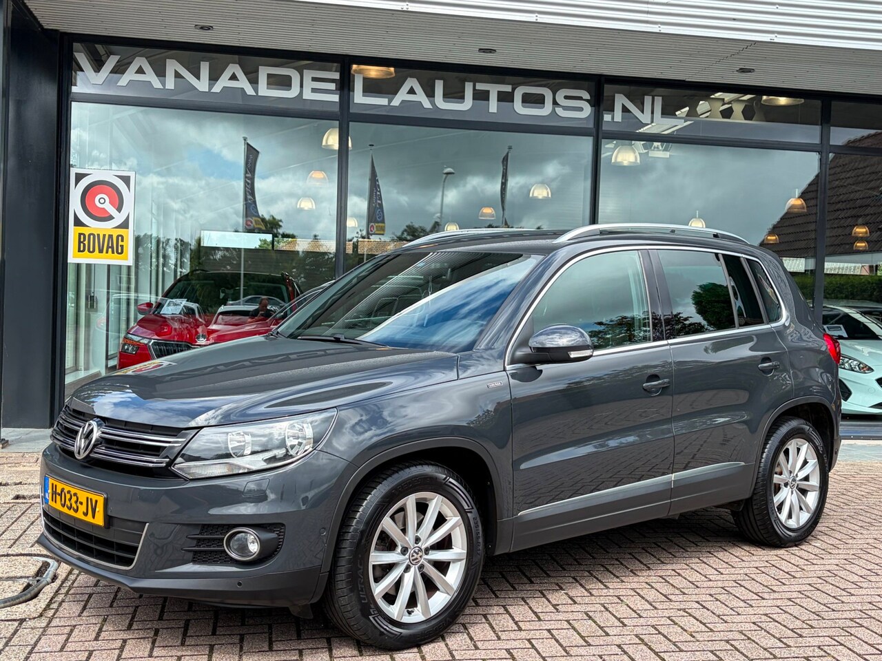 Volkswagen Tiguan - 1.4 TSI R-Line Navi Camera Clima Cruise Trekhaak Volledig Dealeronderhouden! - AutoWereld.nl