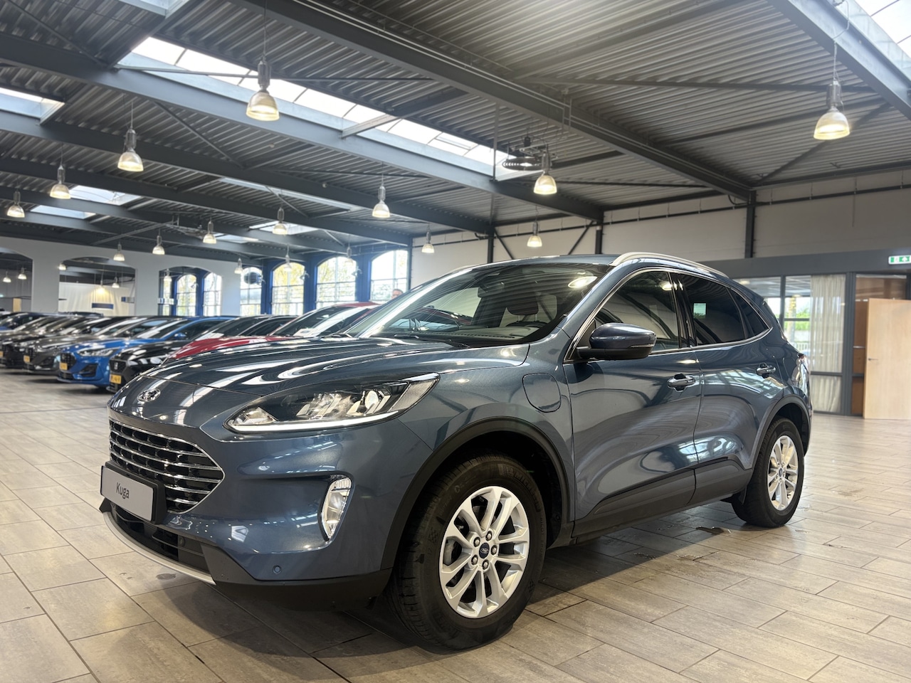Ford Kuga - 2.5 PHEV 225 pk Titanium | Trekhaak | Winter Pack | 100% dealer onderh. | SOH  87,1% | Cam - AutoWereld.nl