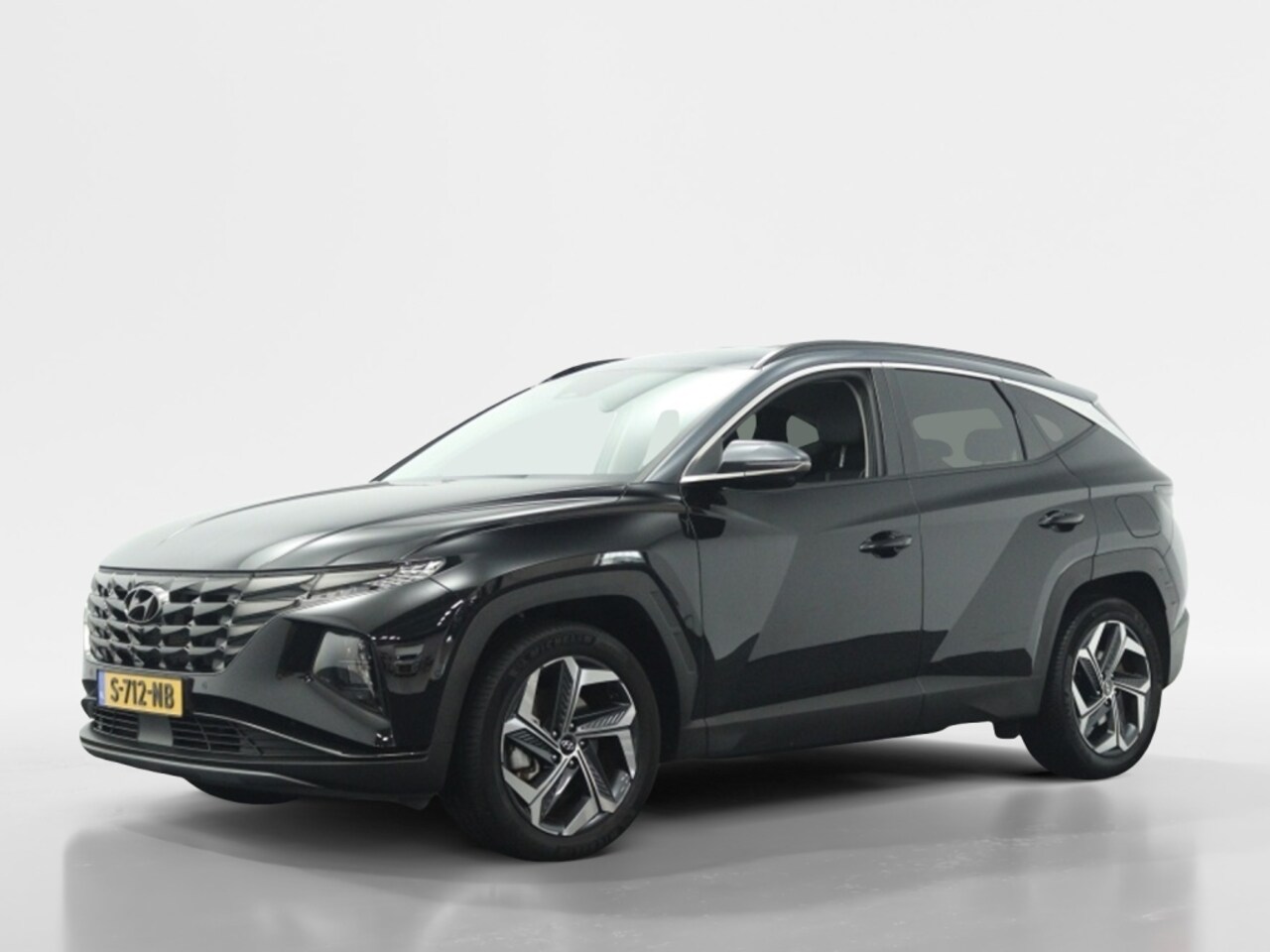 Hyundai Tucson - 1.6 T-GDI HEV Premium | Trekhaak | 360 camera | Navi | Leder - AutoWereld.nl