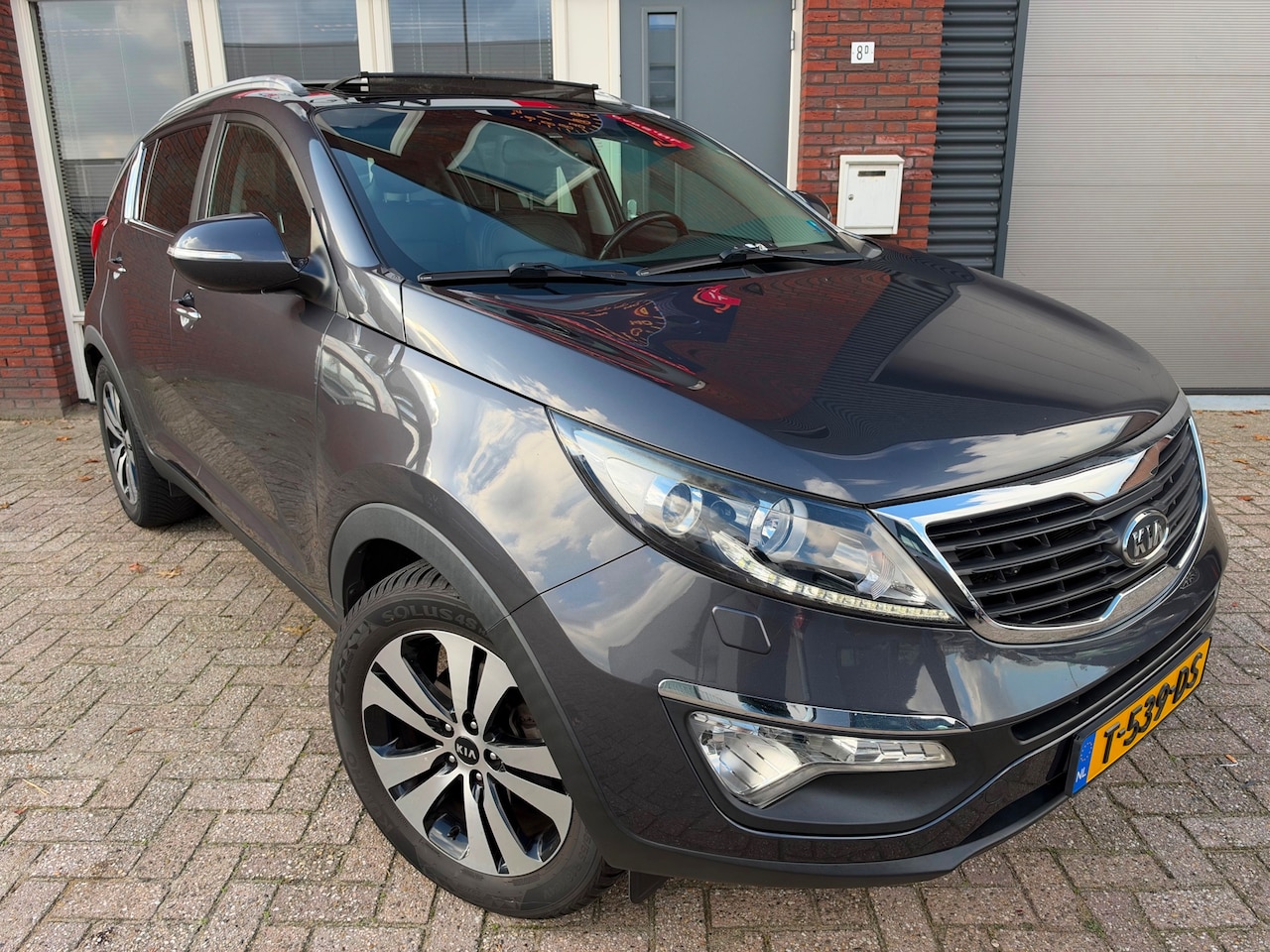 Kia Sportage - 2.0 X-clusive / AUT / PANO / Leder / Camera / PDC - AutoWereld.nl