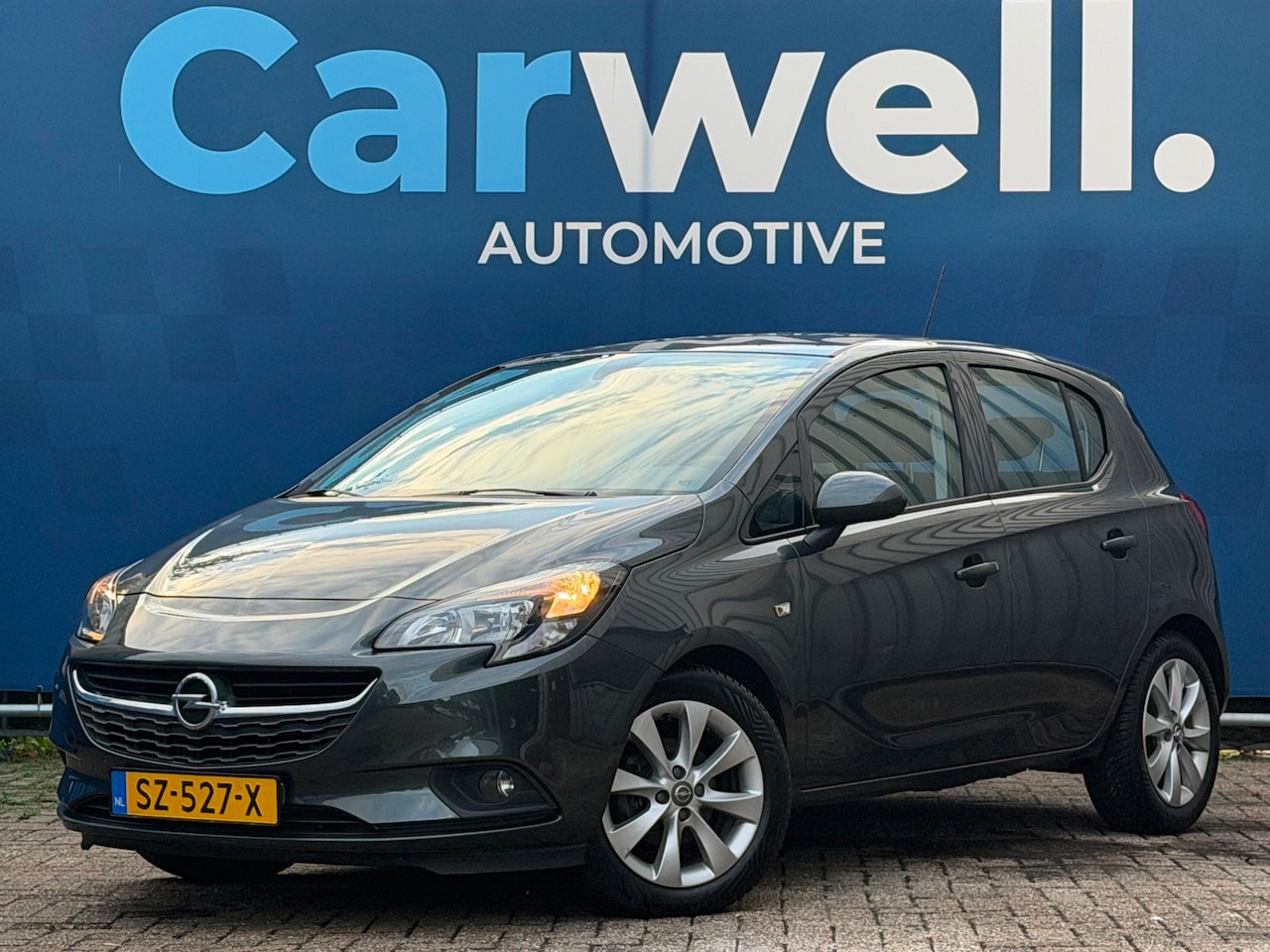 Opel Corsa - 1.4 Favourite|3e Eigenaar|Navi|Airco|Cruise|PDC|ElekRamen|LMV|Isofix|DealerOnderhouden|Apk - AutoWereld.nl