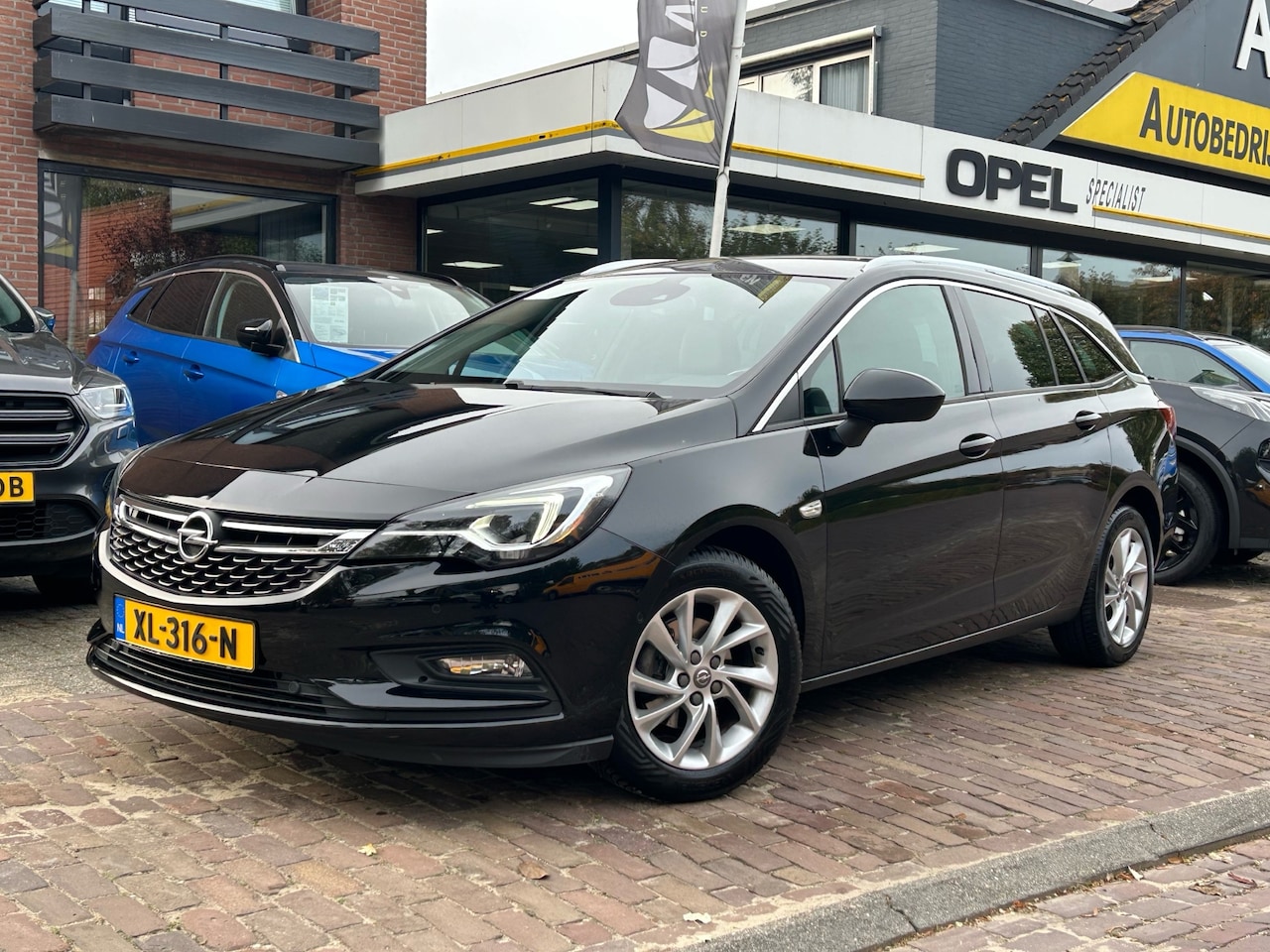 Opel Astra Sports Tourer - 1.0 Turbo 105PK Innovation + 16"/ Navi/ Clima/ Cruise/ Camera/ CarPlay/ Full-LED/ NL auto - AutoWereld.nl