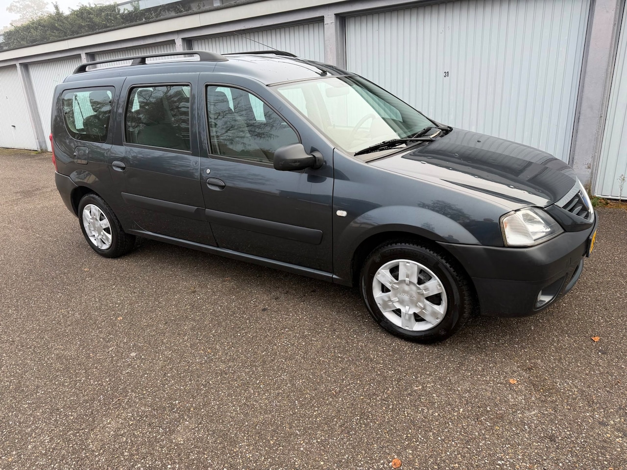 Dacia Logan MCV - 1.6-16V Lauréate 7 PERSOONS MET AIRCO - AutoWereld.nl