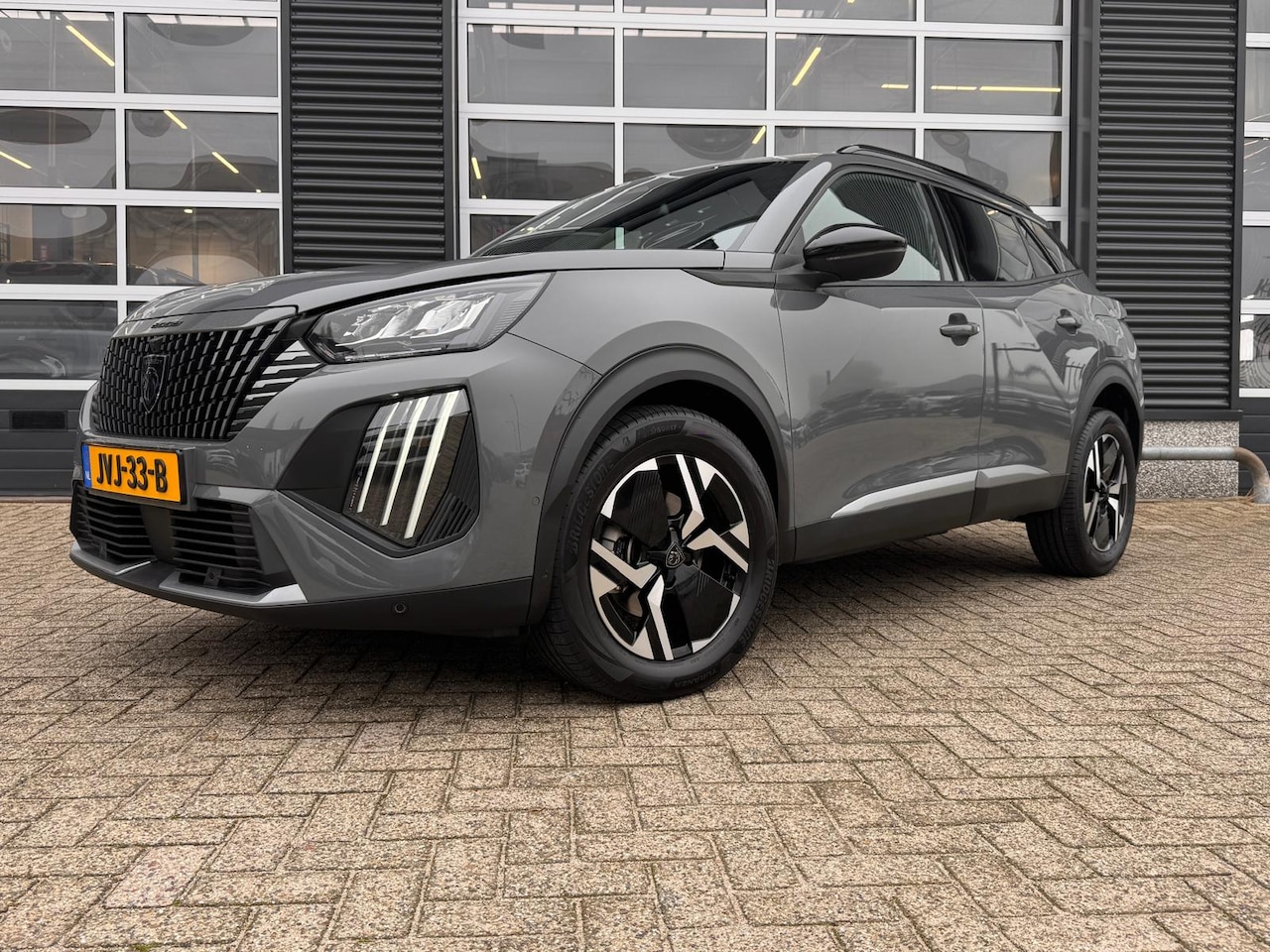 Peugeot 2008 - 1.2 Hybrid 145 Allure | Achterspoiler | Achteruitrijcamera | Airco (automatisch) - AutoWereld.nl