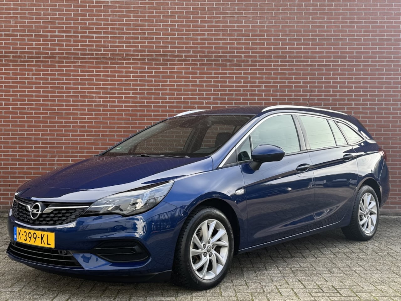 Opel Astra - 1.2 BUSINESS ELEGANCE NAV CRUISE CARPLAY TREKHAAK CAMERA LMV - AutoWereld.nl