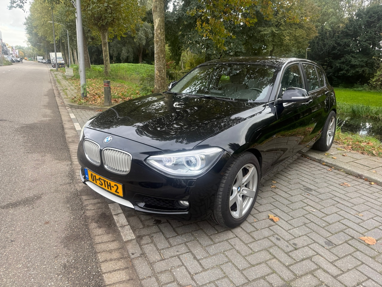 BMW 1-serie - 118i Business AUT NAVI LEER - AutoWereld.nl