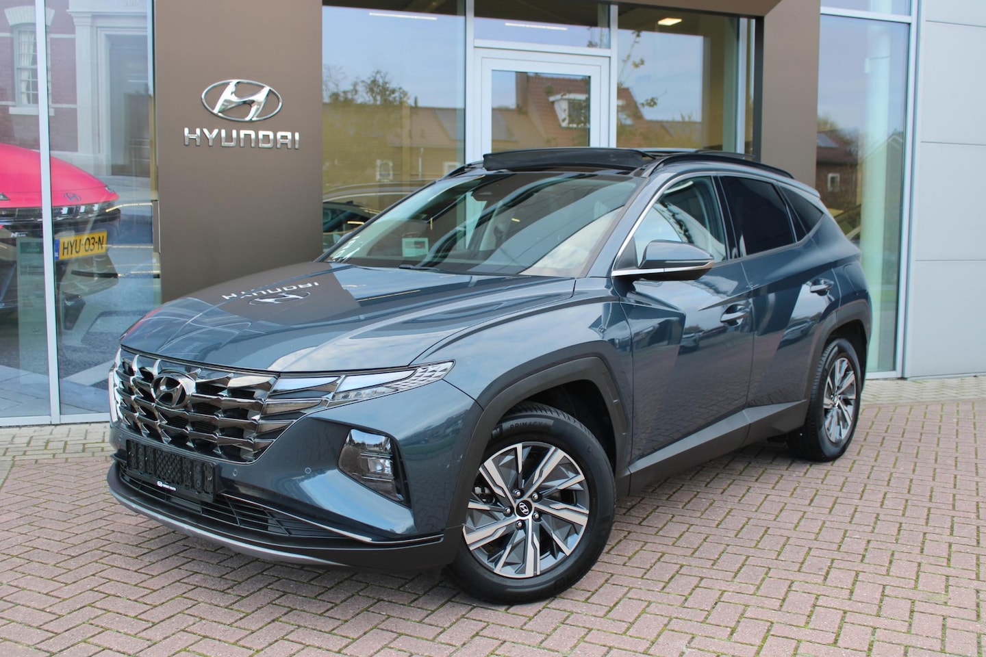 Hyundai Tucson - 1.6 T-GDI HEV 230 Comfort Smart Sky Automaat Hybrid Panoramadak Trekhaak 1650kg - AutoWereld.nl