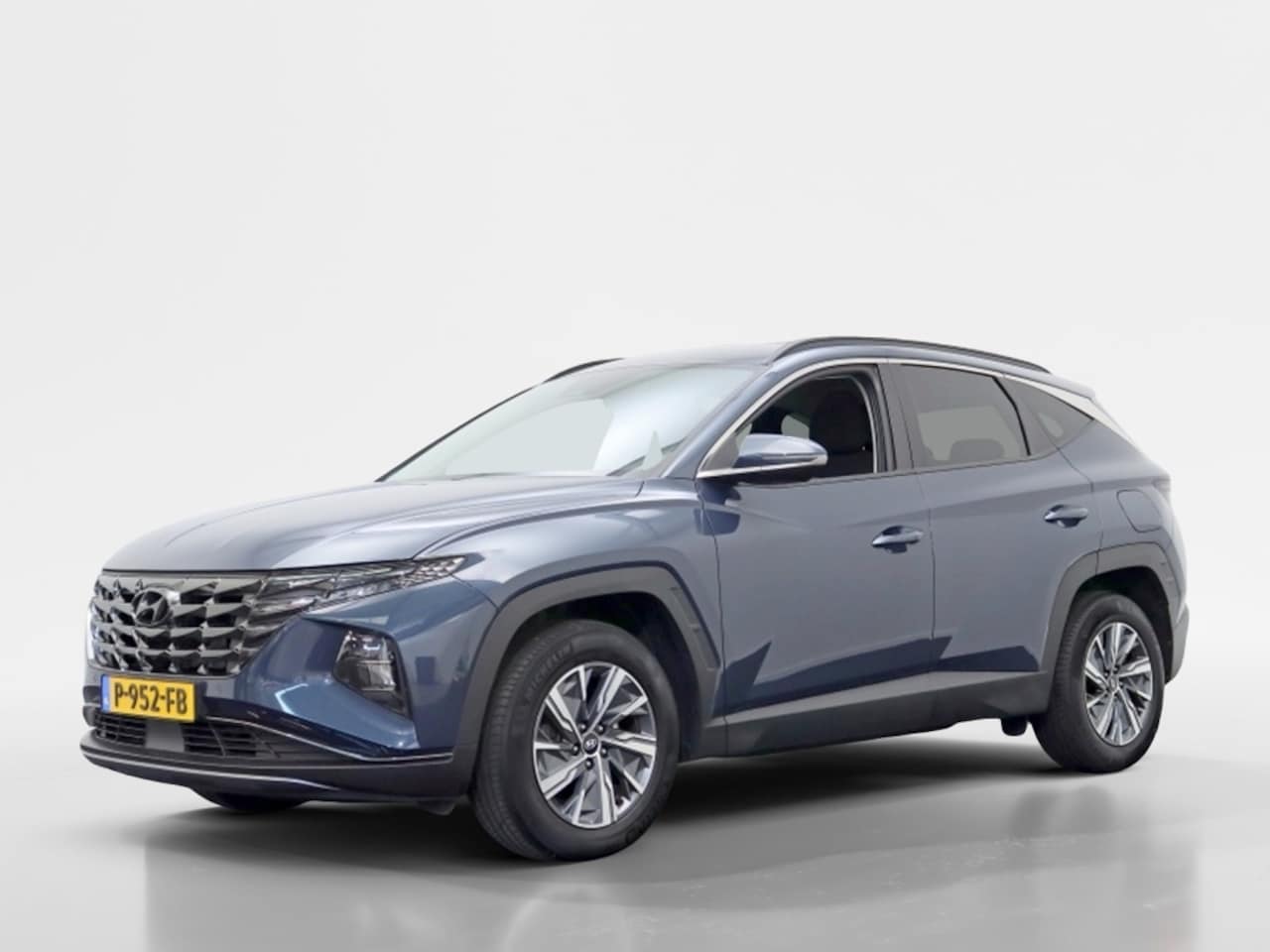 Hyundai Tucson - 1.6 T-GDI HEV Comfort | Navigatie | Stoelverwarming | Trekhaak - AutoWereld.nl