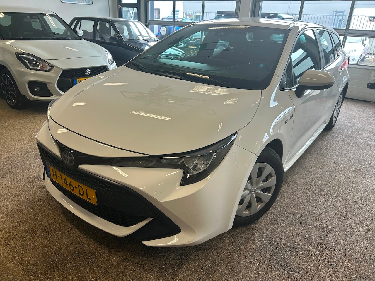 Toyota Corolla Touring Sports - 1.8 Hybrid Comfort All Season - AutoWereld.nl