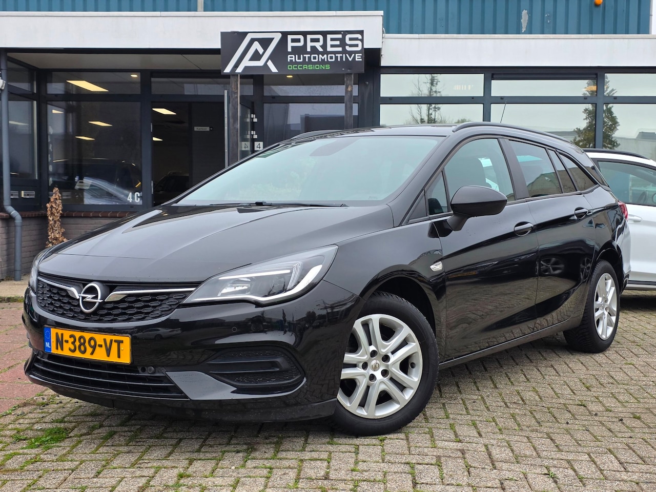 Opel Astra Sports Tourer - 1.2 Edition |AIRCO|CRUISE|PDC|TREKHAAK - AutoWereld.nl